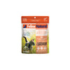 Feline Natural Freeze Dried Lamb & King Salmon Feast cat food pouch with a cat in a field.