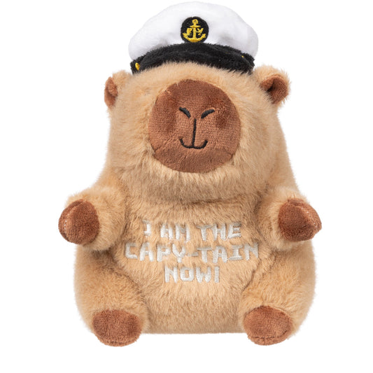 FuzzYard Capy-tain plush dog toy: a fluffy brown capybara wearing a white captain's hat, embroidered with "I AM THE CAPY-TAIN NOW!