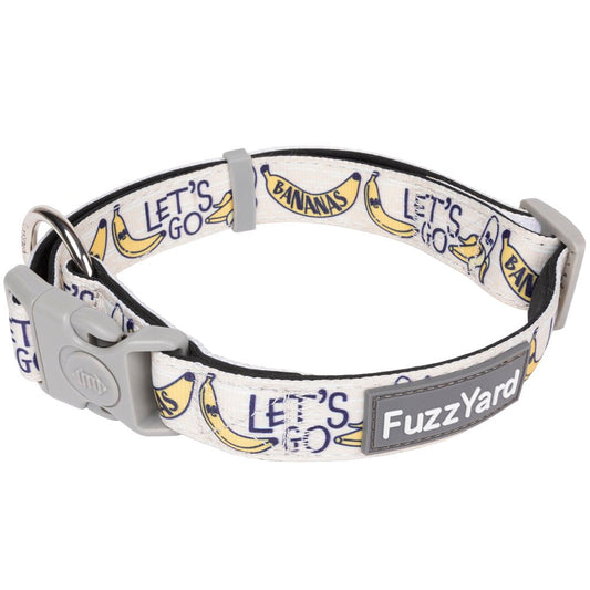 FuzzYard Go Bananas dog collar: white neoprene with yellow banana print, grey buckle, and D-ring.
