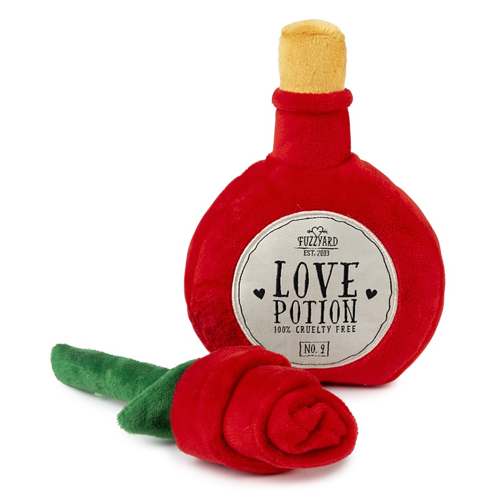Red plush "Love Potion" bottle dog toy with a yellow cork and a red plush rose with a green stem.
