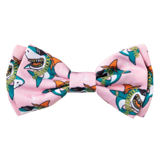Pink polyester pet bow tie with funky blinged-up shark print, featuring a velcro loop.