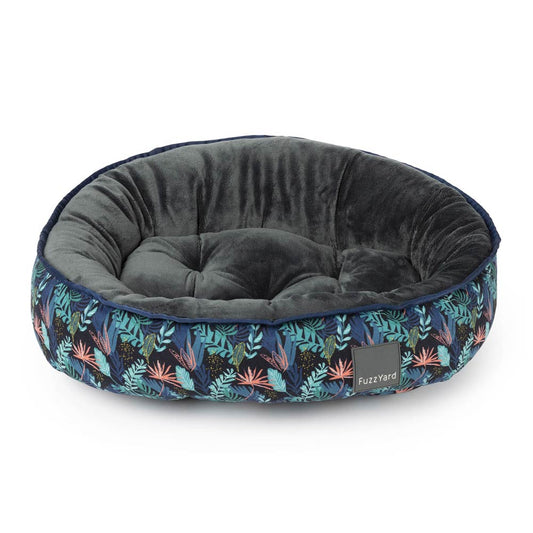 FuzzYard Reversible Dog Bed in Amazonia, featuring a dark tropical leaf pattern and a soft grey interior.