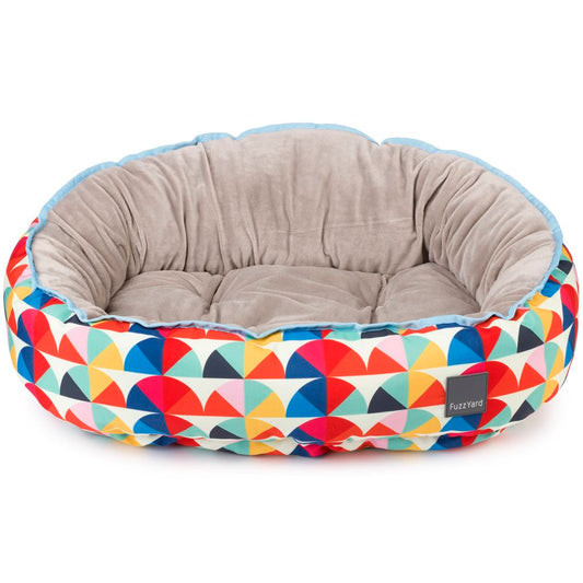 FuzzYard Reversible Dog Bed (Boogie) with colorful geometric print exterior and soft grey plush interior.