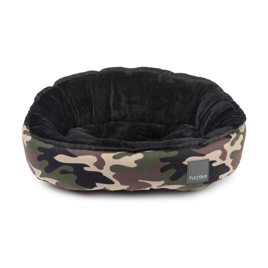 FuzzYard Reversible Dog Bed in Camo, featuring a green, brown, and black camouflage exterior and a soft black interior.