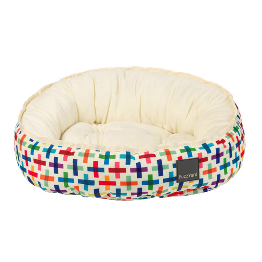 FuzzYard Reversible Dog Bed (Jenga) with colorful geometric cross pattern and soft cream plush interior.