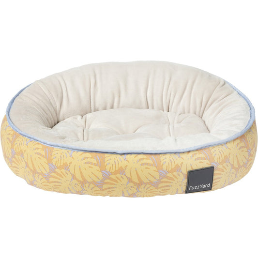 FuzzYard Reversible Dog Bed (Maui) with yellow tropical leaf print and soft cream interior.