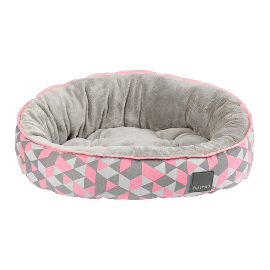 FuzzYard Reversible Dog Bed in Morganite, featuring pink, grey, and white geometric patterns with a plush grey interior.