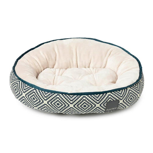FuzzYard Mykonos reversible dog bed with forest green aztec pattern and soft cream interior.