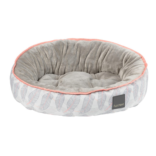 FuzzYard Reversible Dog Bed (Paia) with grey plush interior and white exterior with pink and grey feather print.