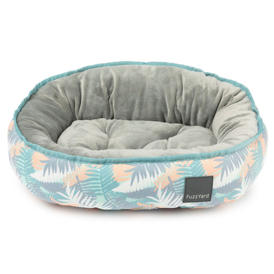FuzzYard Reversible Dog Bed in Panama, featuring a tropical leaf print and soft grey velvety interior.