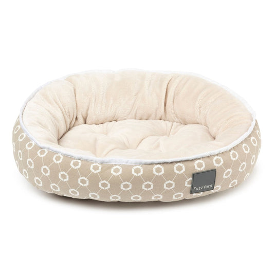 FuzzYard Reversible Dog Bed in Rijeka with beige geometric pattern and soft cream interior.