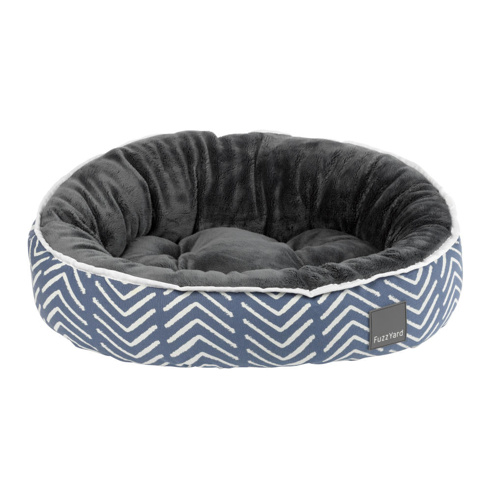 FuzzYard Sacaton reversible dog bed with blue and white chevron pattern, soft grey plush interior.