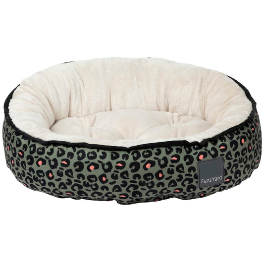 FuzzYard Reversible Dog Bed in Savanna design, featuring a green leopard print exterior and a soft cream interior.
