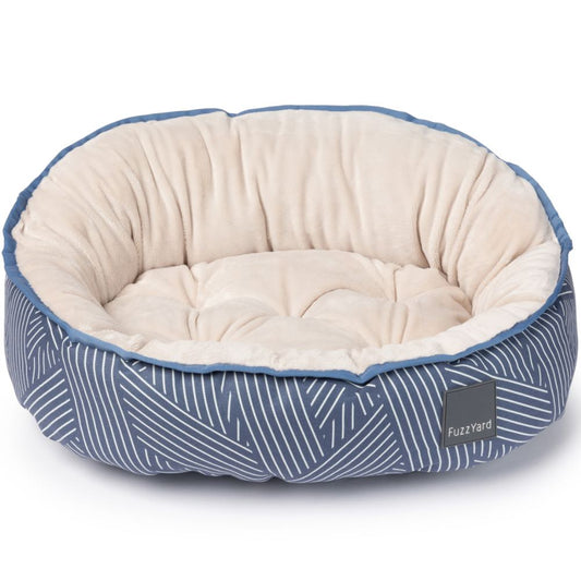 FuzzYard Reversible Dog Bed in Thornbury Aegean Blue with geometric stripes and a plush cream interior.