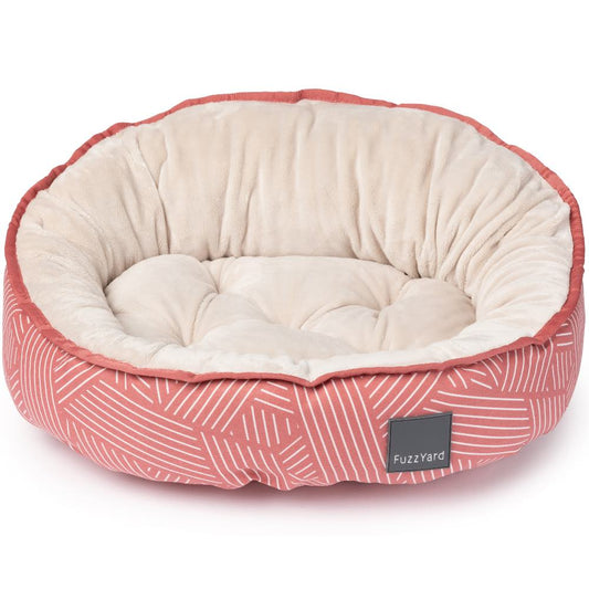FuzzYard Reversible Dog Bed in Thornbury Brick Red with white geometric lines and a plush cream interior.