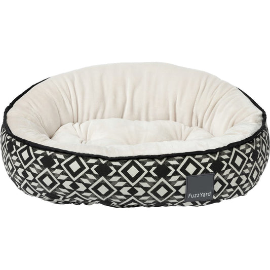 FuzzYard Reversible Dog Bed in Yucatan design, featuring black and white geometric patterns with a soft cream interior.