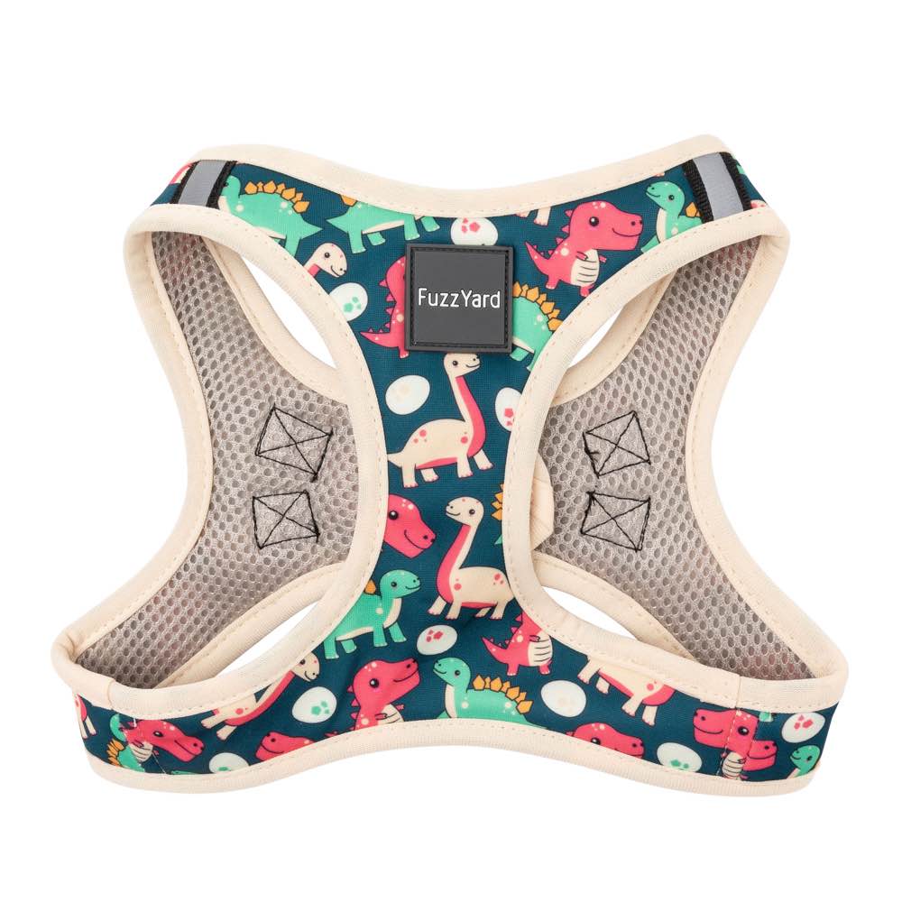 FuzzYard Step-In Dog Harness in Dinosaur Land, featuring colorful dinosaurs on dark teal polyester.