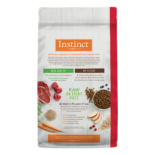 Instinct Be Natural Real Beef & Barley dry dog food bag with ingredients like beef, carrots, and kibble.