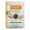 Instinct Be Natural Real Chicken & Brown Rice dry dog food bag with ingredients like chicken, carrots, and oats.