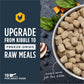 Instinct Freeze-dried Raw Meals: chicken dog food in a silver bowl with spinach, blueberries, apple, and pumpkin.