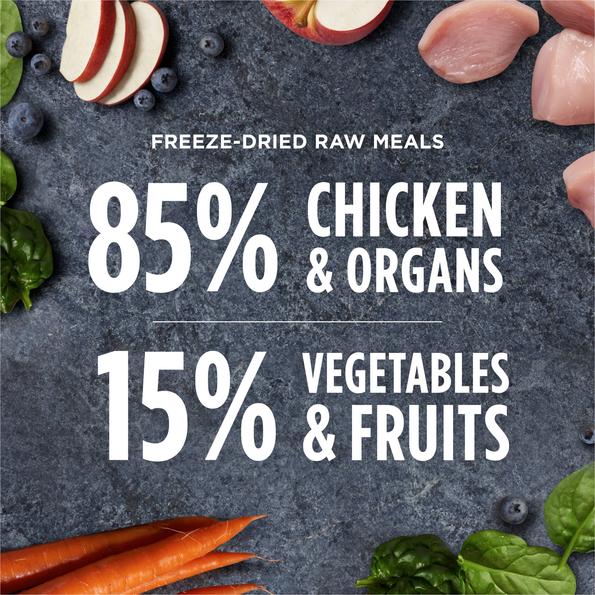 Instinct Freeze-dried Raw Meals with chicken, organs, vegetables, and fruits on a dark gray surface.