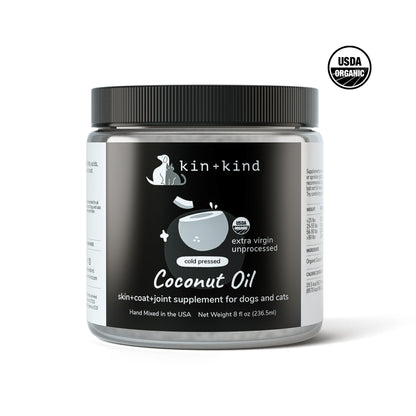 Kin+Kind Raw Coconut Oil in an 8 fl oz clear jar with a black lid, featuring a white label.