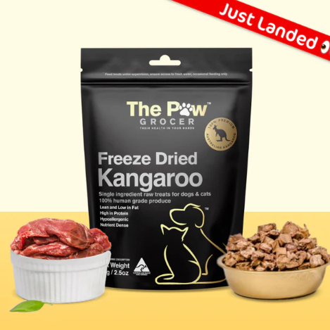 Black pouch of The Paw Grocer Freeze Dried Kangaroo treats, with raw meat and freeze-dried pieces in bowls.