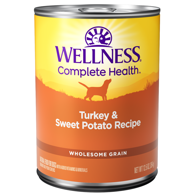 Wellness Complete Health Turkey & Sweet Potato wet dog food, 12.5oz can with orange and yellow label.