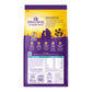 Wellness Complete Health Whitefish & Sweet Potato dry dog food bag with kibble, purple and yellow design.