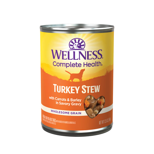 Wellness Complete Health Turkey Stew wet dog food can, 12.5oz, with a heart-shaped view of the stew.
