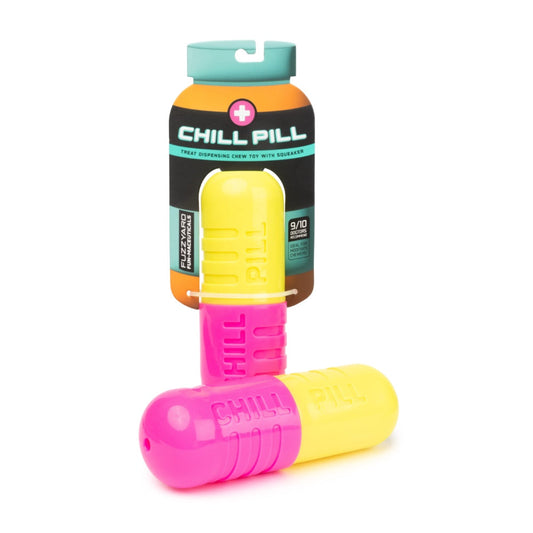 Pink and yellow FuzzYard Chill Pill treat-dispensing dog toy, 17cm long, with packaging.
