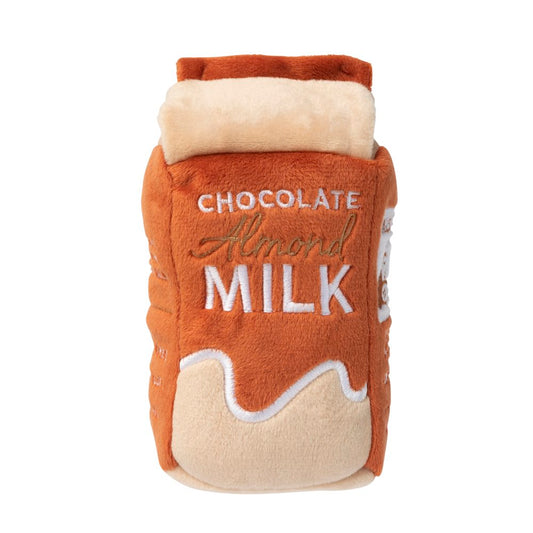 FuzzYard Chocolate Almond Milk plush dog toy, brown and cream, with "Chocolate Almond Milk" embroidered.