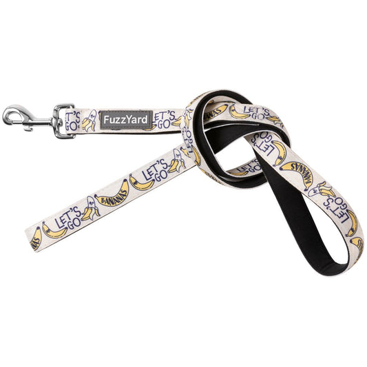 FuzzYard Go Bananas dog leash: light beige neoprene with yellow bananas, "Let's Go" text, and a silver swivel clasp.