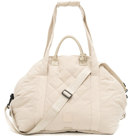 Sandstone FuzzYard Life quilted multipurpose pet carrier and car seat with adjustable straps.