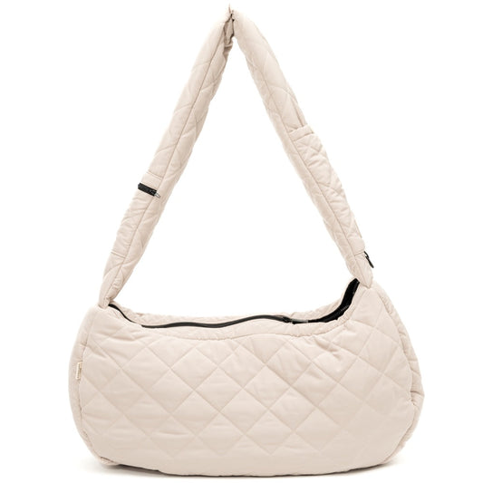 FuzzYard Life quilted sandstone dog carrier with padded strap and black zipper.