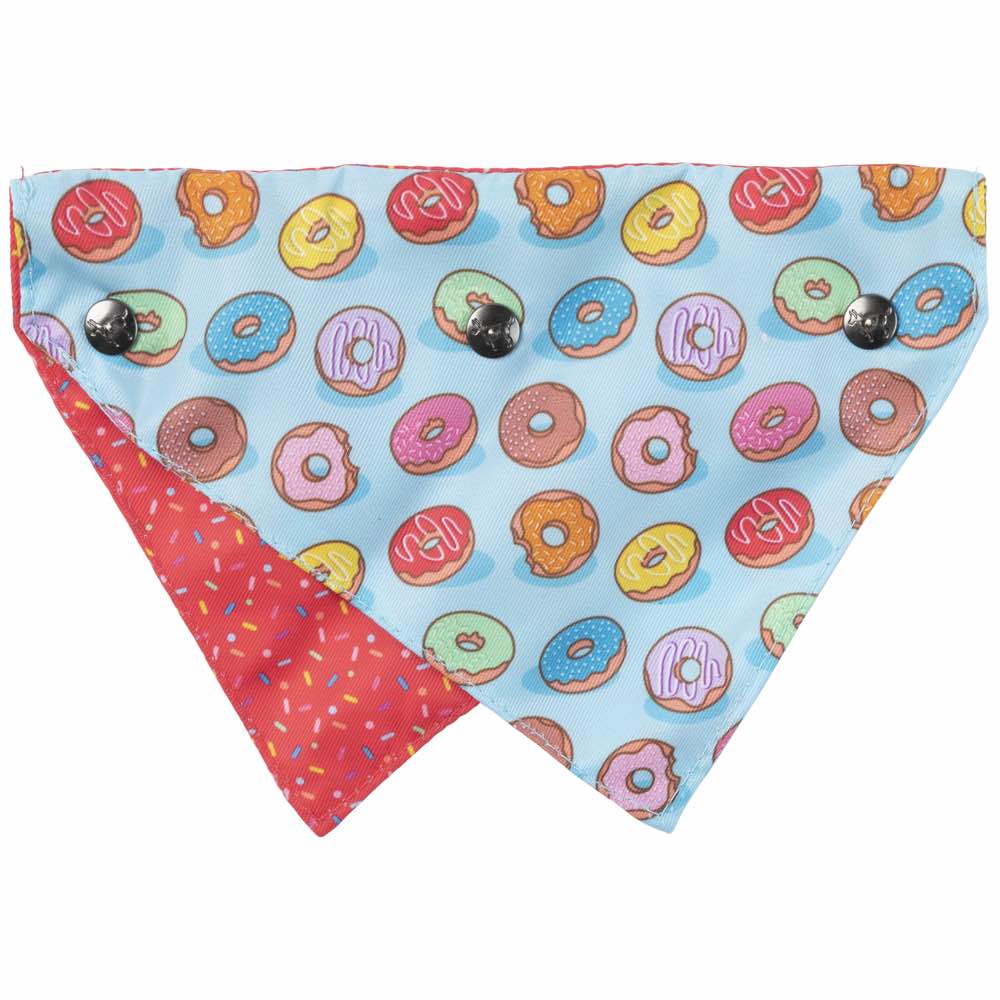 Reversible FuzzYard pet bandana with colorful donuts on light blue and red sprinkles on red.