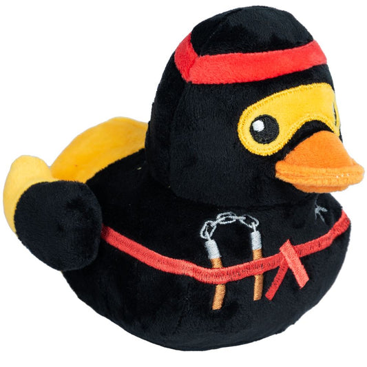 Black plush ninja duck dog toy with yellow wings, orange beak, red headband, and embroidered nunchucks.