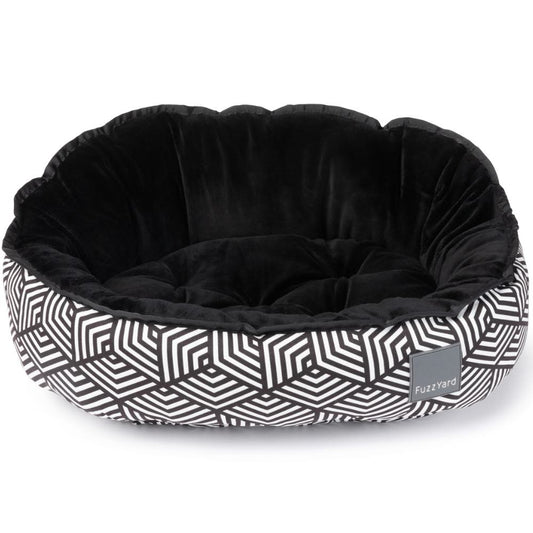 FuzzYard Reversible Dog Bed (Fitzroy) with black velvet interior and black & white geometric pattern exterior.