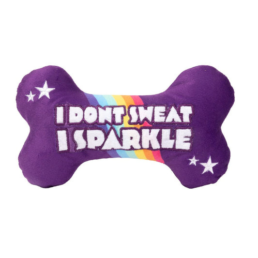 FuzzYard Sparkle Bone Dog Toy: Purple plush bone with "I DON'T SWEAT I SPARKLE" text on a rainbow stripe.